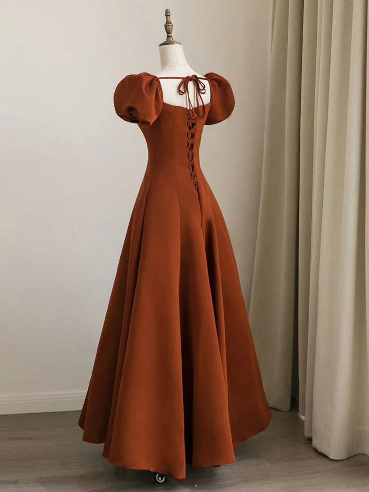 Side view of the A-line satin prom dress, showcasing puff sleeves and flowing skirt.