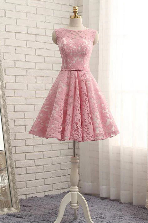 Side view of a model wearing the pink A-Line lace short prom dress.