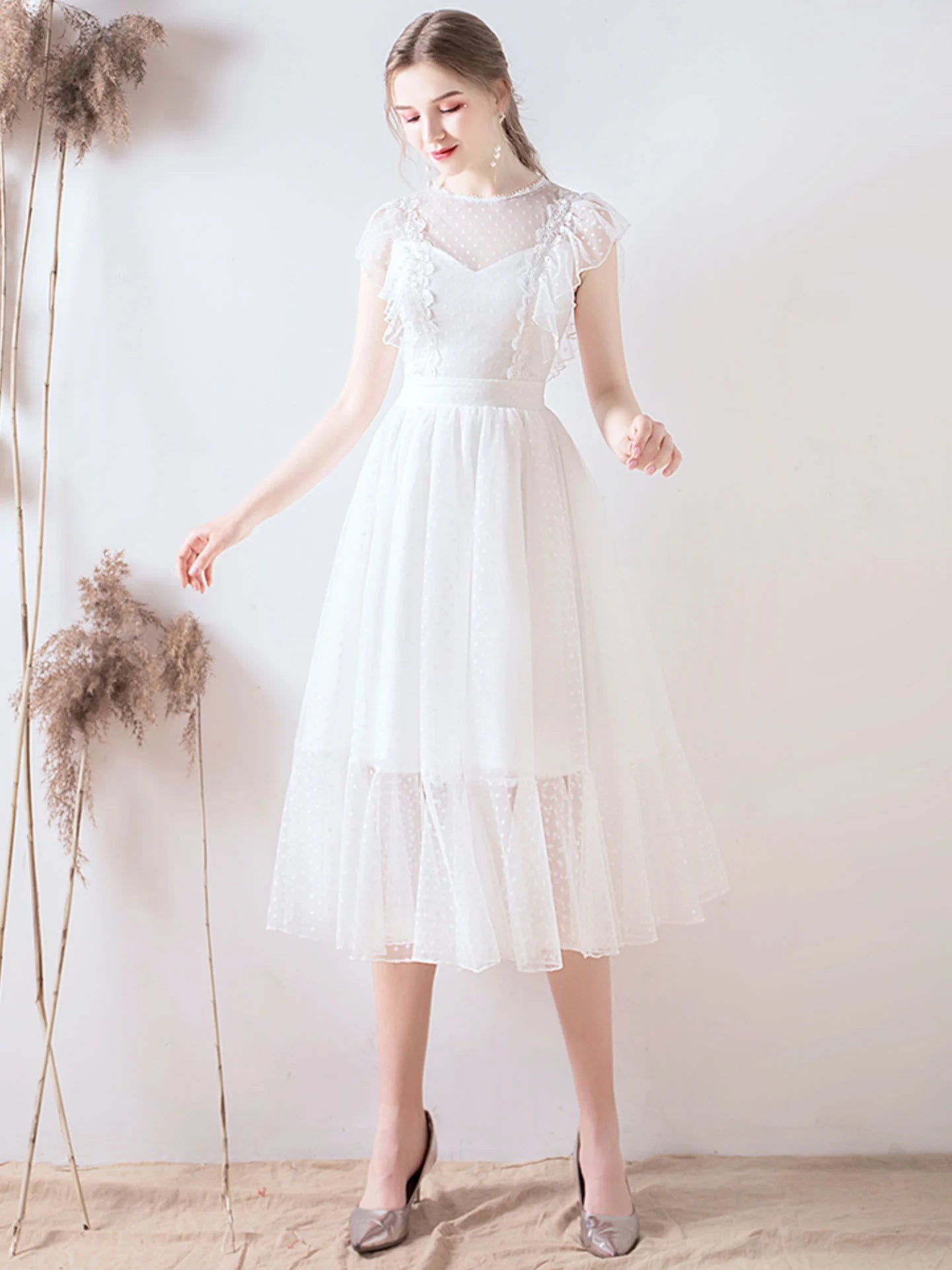 White A-line short prom dress with round neck and lace details.