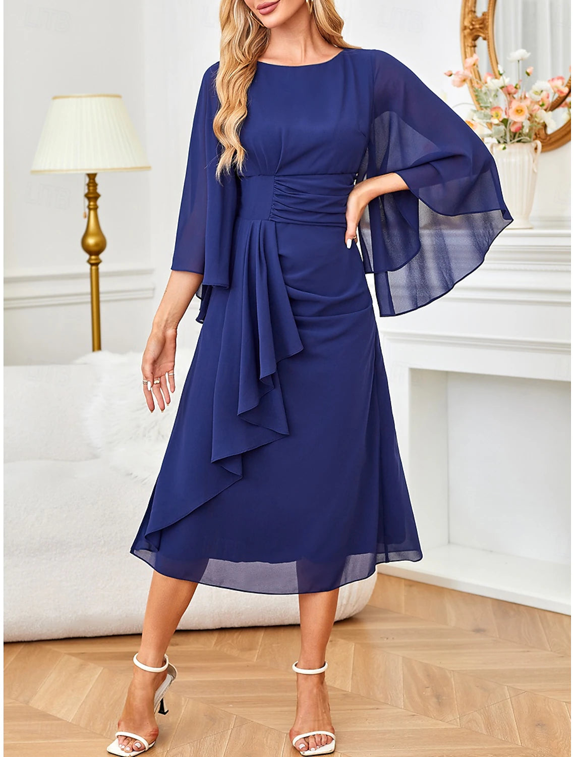 Woman wearing a dark blue A-line ruched ruffle half-sleeve midi dress, front view.
