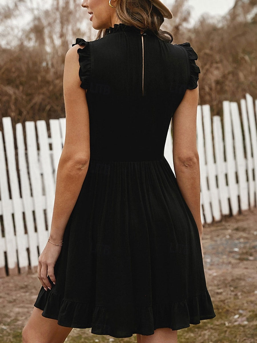 Woman in a high neck sleeveless A-line ruffle mini dress, side profile.