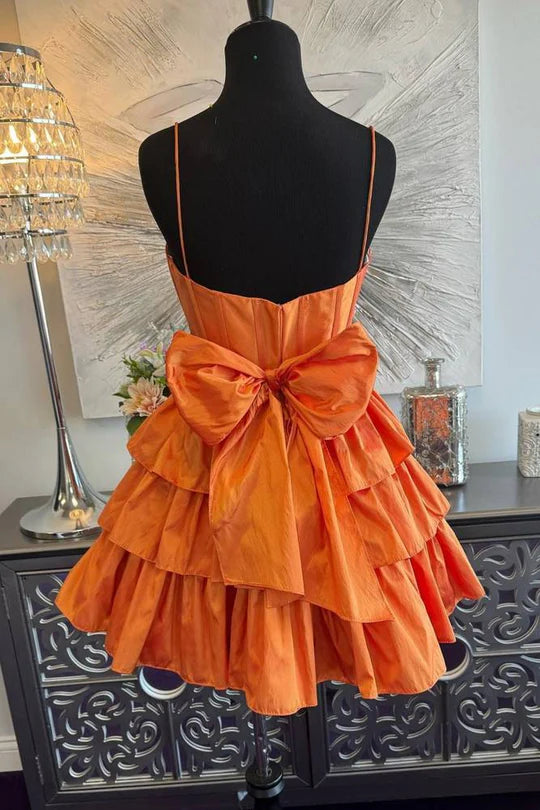 Back view of the A-line satin dress, highlighting the ruffle details.