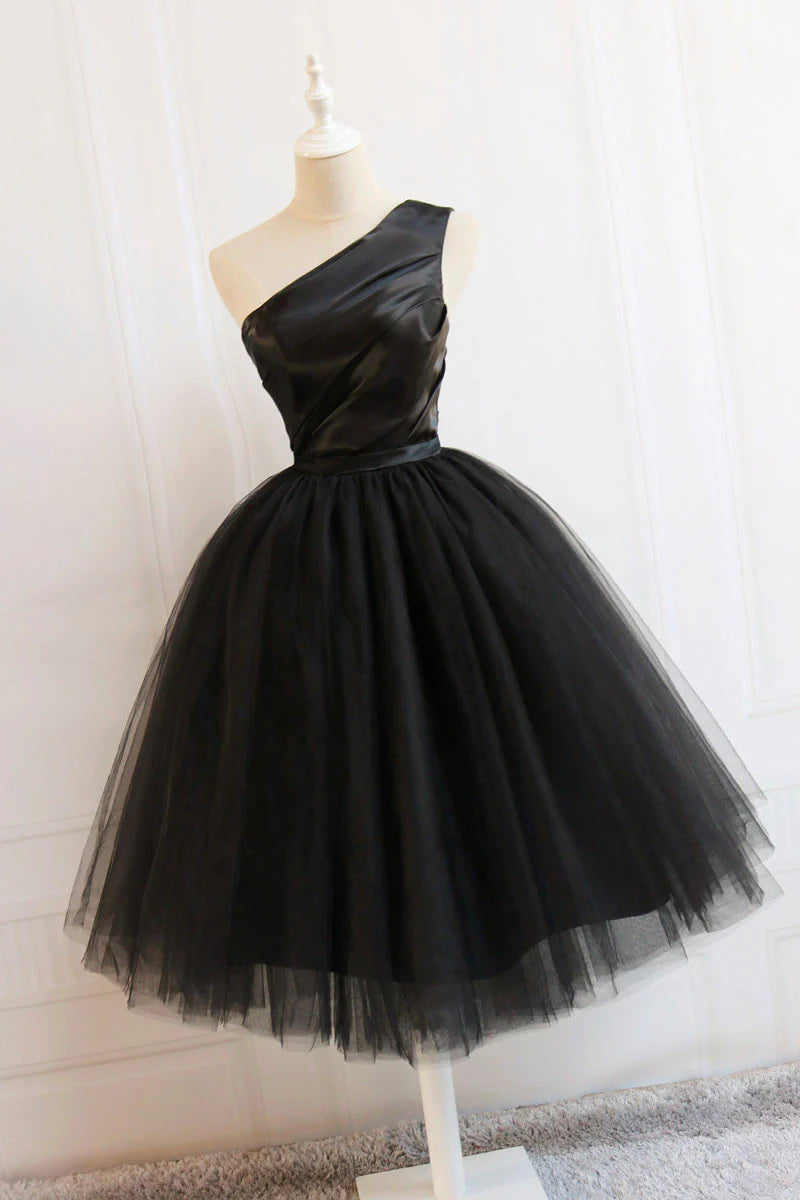 Model wearing a short black A-line prom dress with a cinched waist.