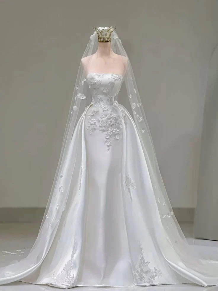 Elegant A-Line white satin wedding dress with intricate 3D floral appliques.