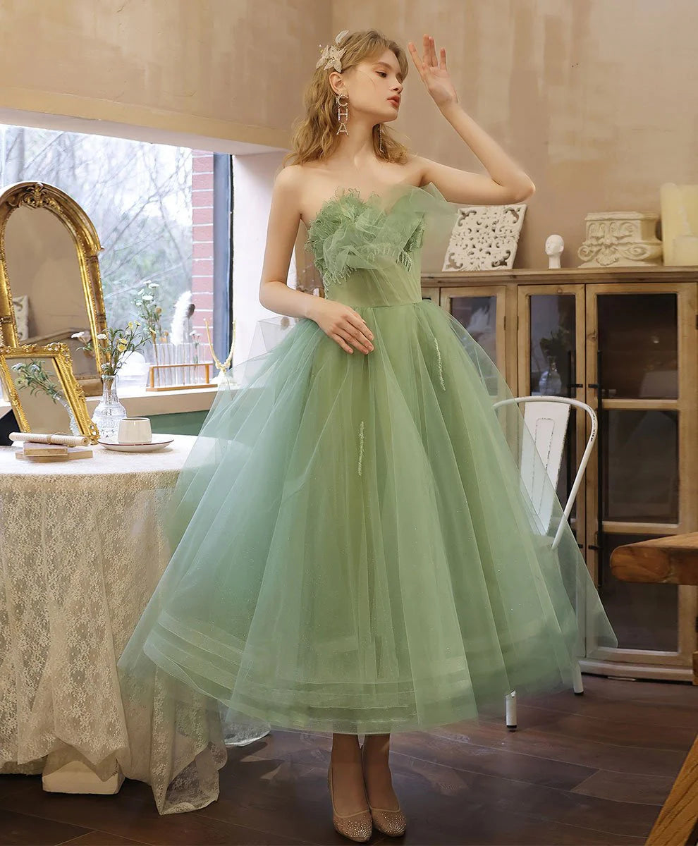 Elegant green tea-length formal prom dress with a lace bodice and flowing tulle skirt.