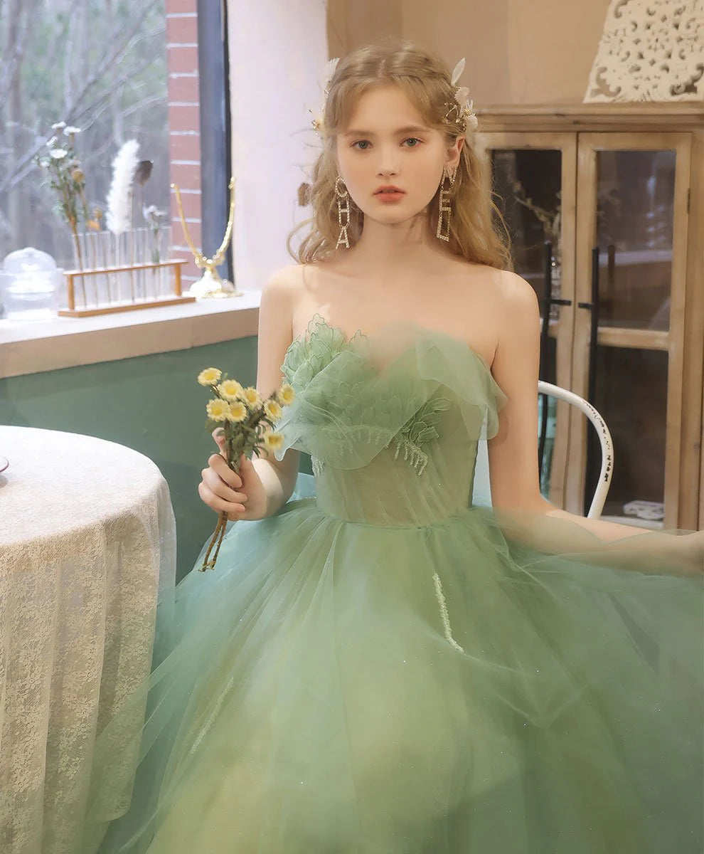 Back view of the green lace and tulle tea-length formal dress.