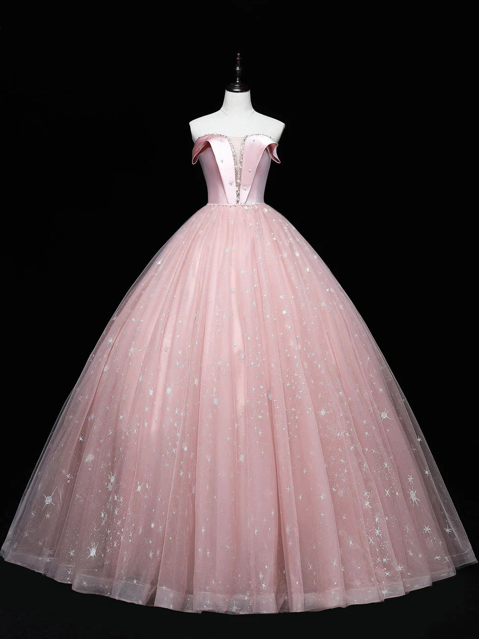 Elegant pink tulle ball gown prom dress with a flowing skirt.