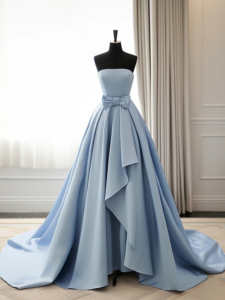 Elegant A-line satin blue long prom dress on a model, showcasing its flowing silhouette.