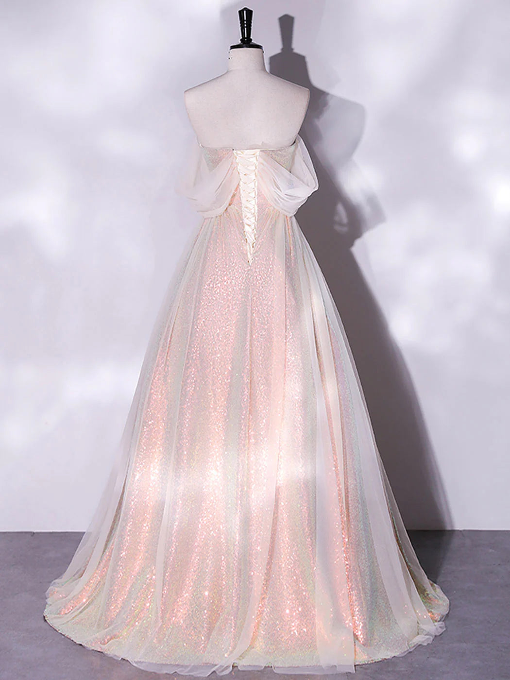 Back view of the pink tulle formal dress with lace-up detail.