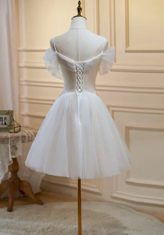 Back and side view of the short champagne tulle lace homecoming dress.
