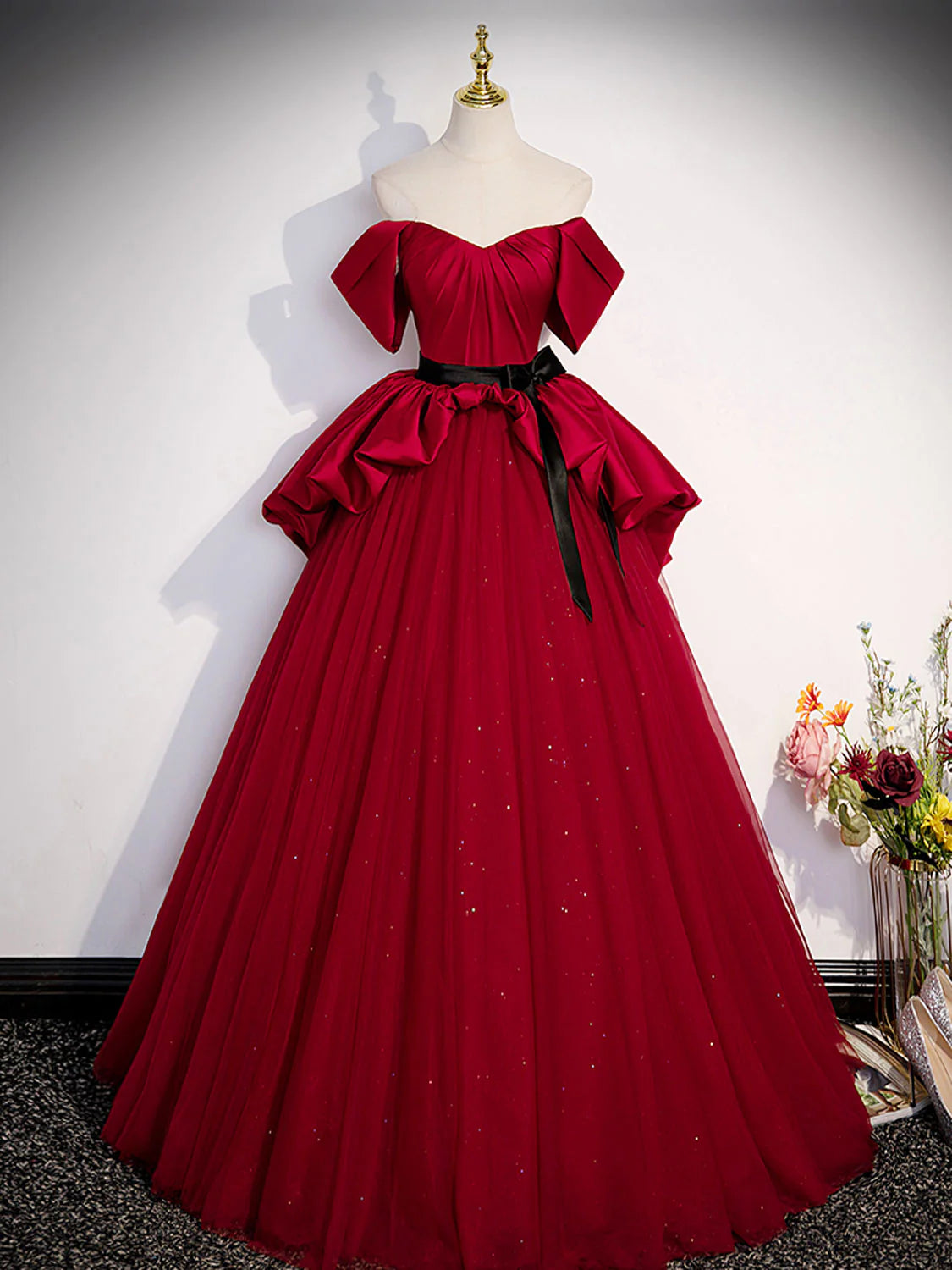 Model in elegant A-line burgundy satin long prom dress, front view.