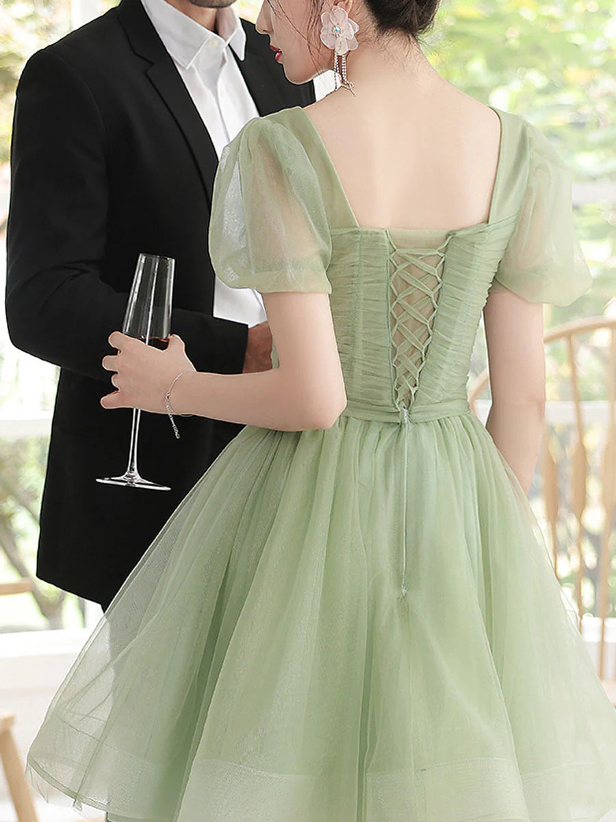 Back view of the green square neck short tulle dress.