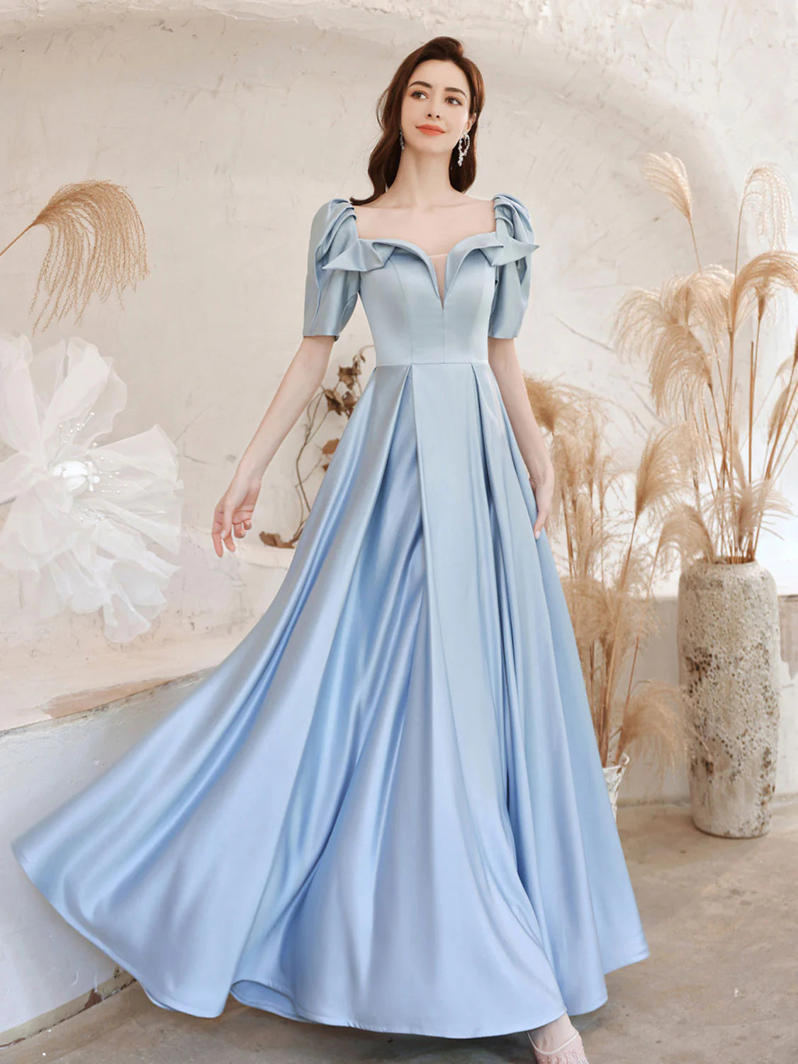Model wearing an elegant A-line square neck satin blue long prom dress.