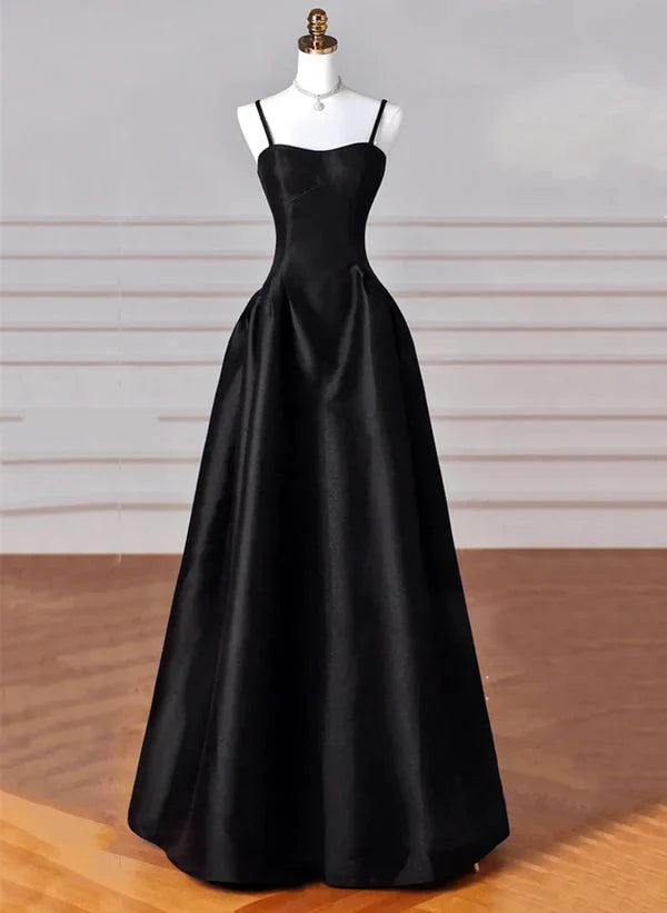 Model wearing an elegant black A-line satin long prom dress with a square neck.