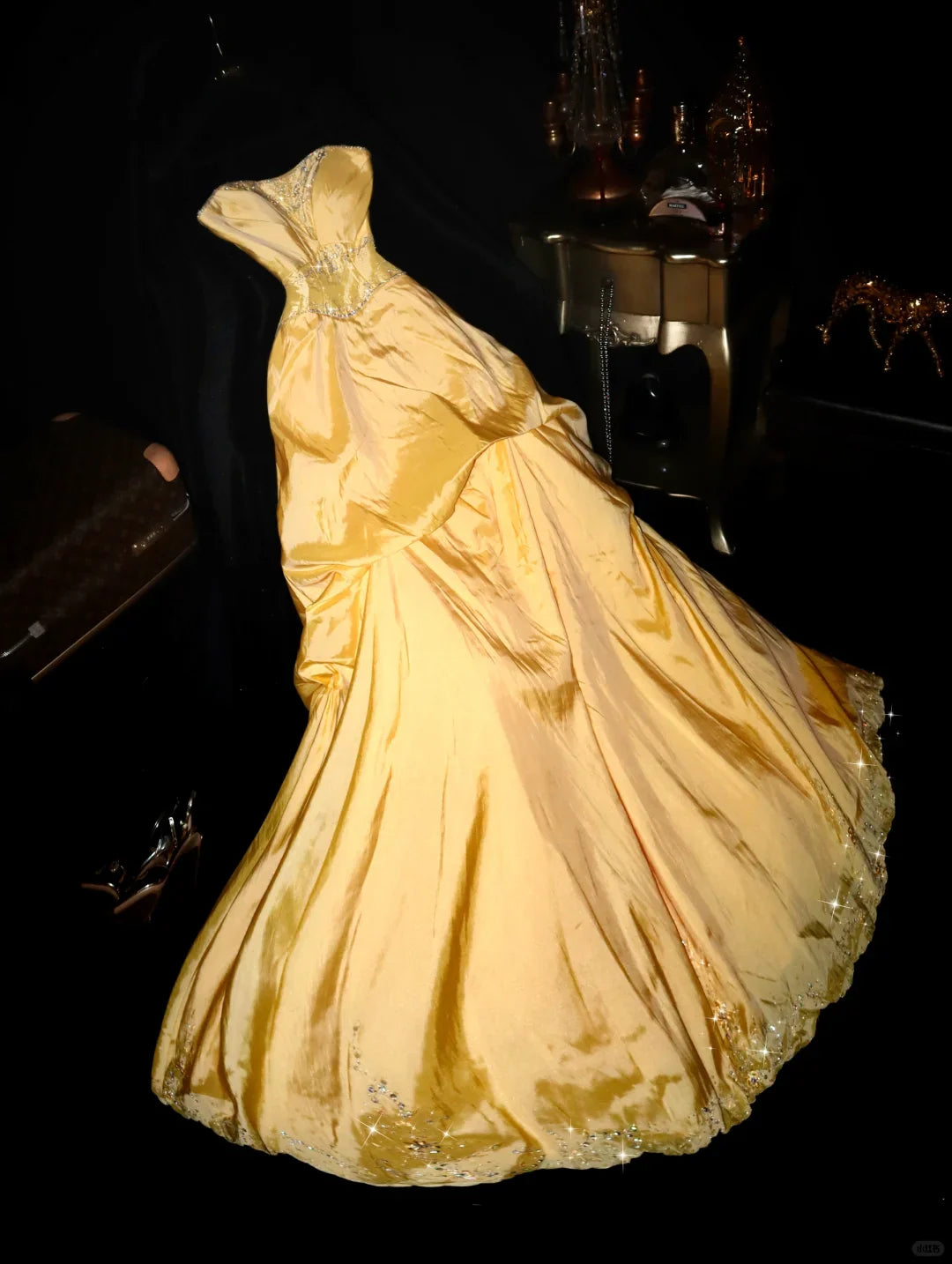 Elegant yellow A-line strapless satin long party dress with beaded and sequin details.
