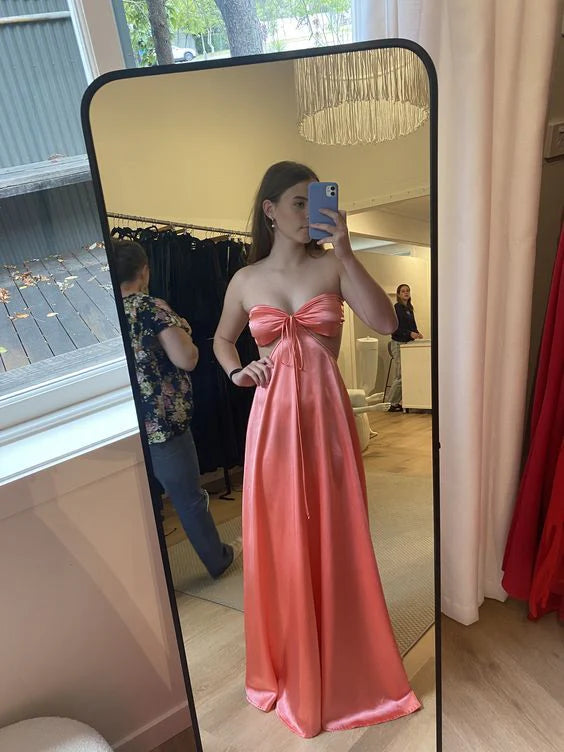 Full-length view of the yellow A-line satin prom dress, showcasing its flowing skirt.
