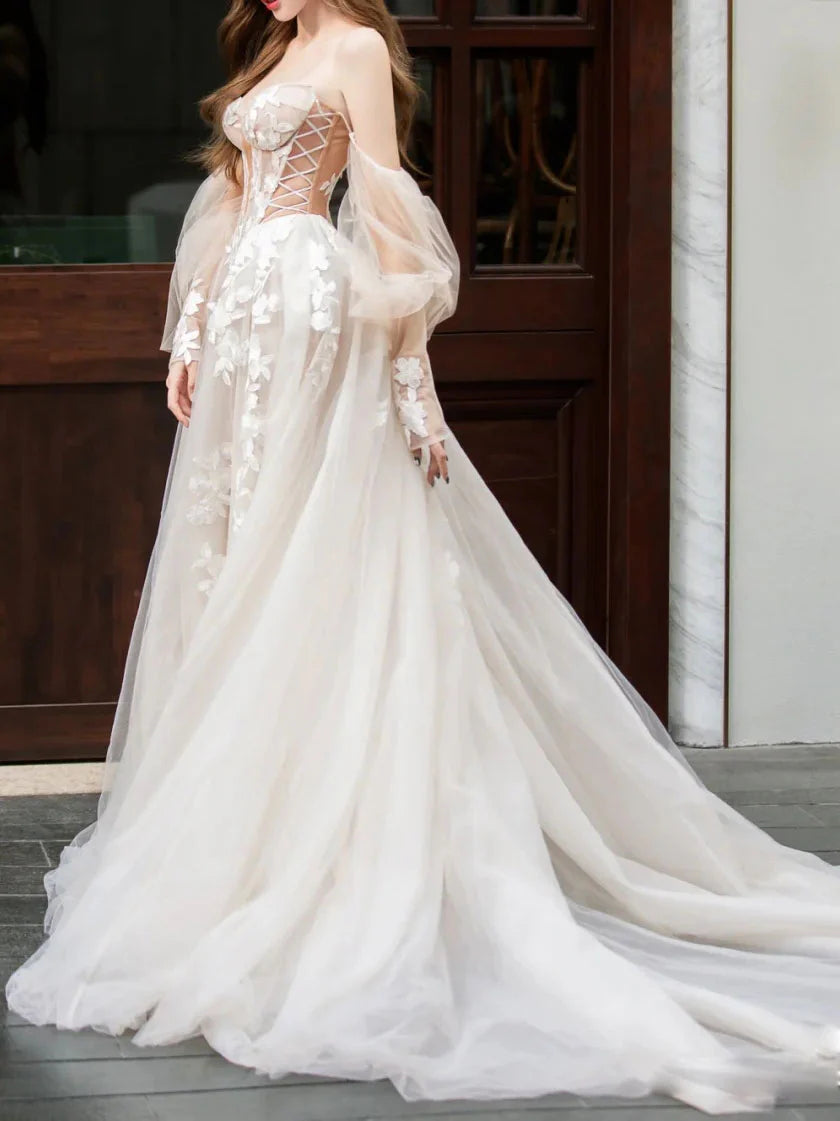 Elegant light champagne long formal gown with intricate lace details.