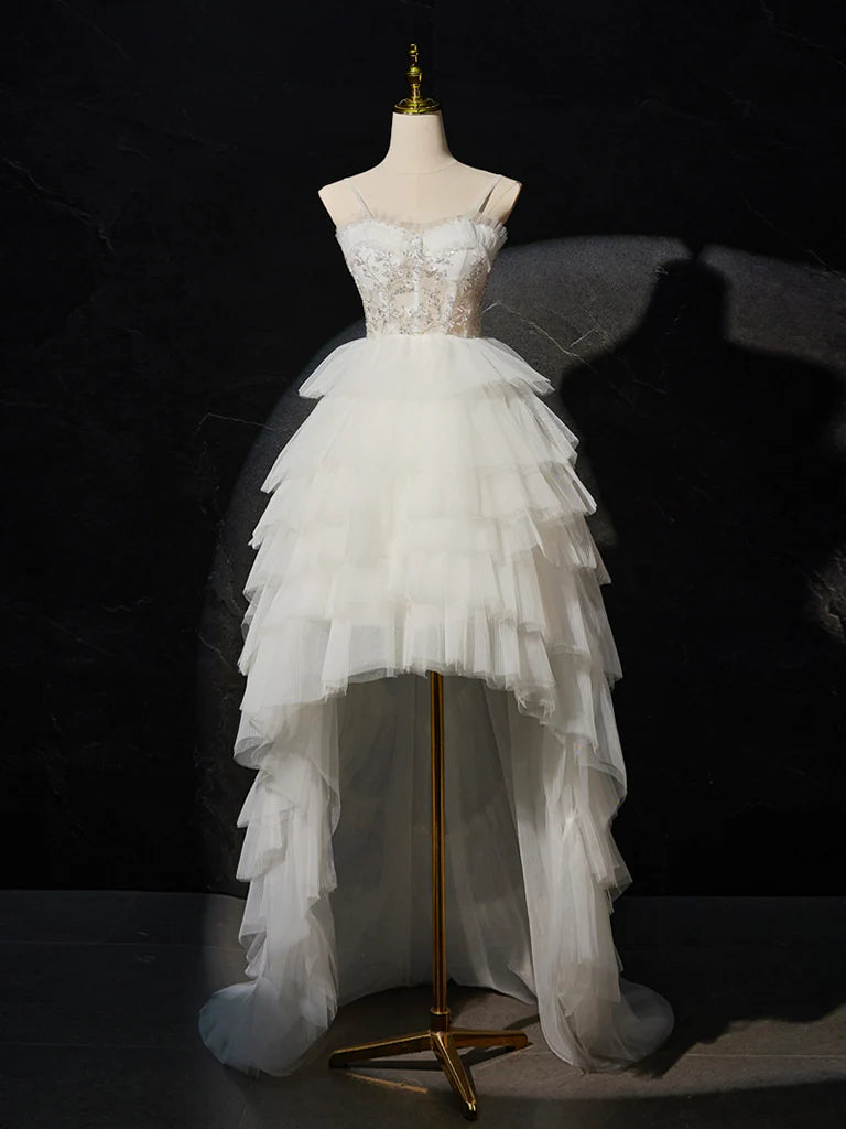 Model wearing a white sweetheart neck high-low lace and tulle prom dress.
