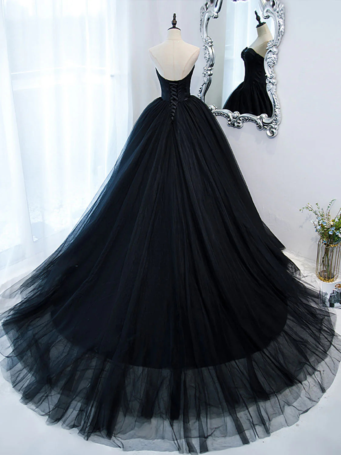 Back view of the elegant black sweetheart neck formal dress, highlighting the silhouette.