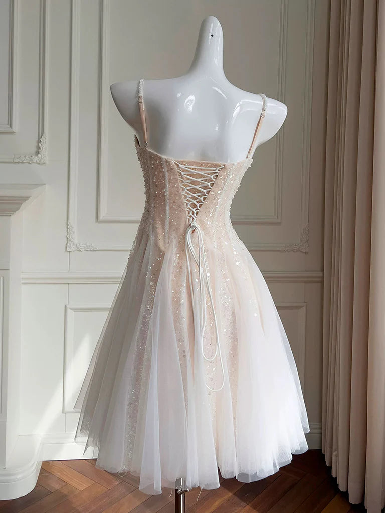 Side view of the light champagne sequin tulle short prom dress.