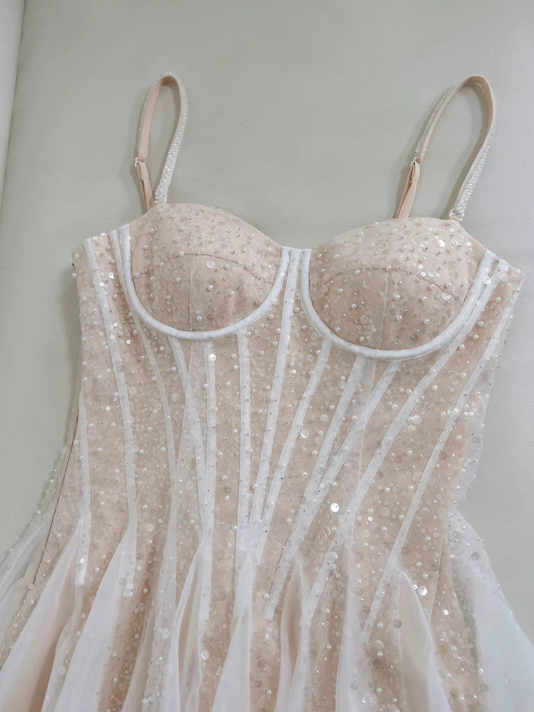 Back view of the A-line sweetheart neck light champagne prom dress.
