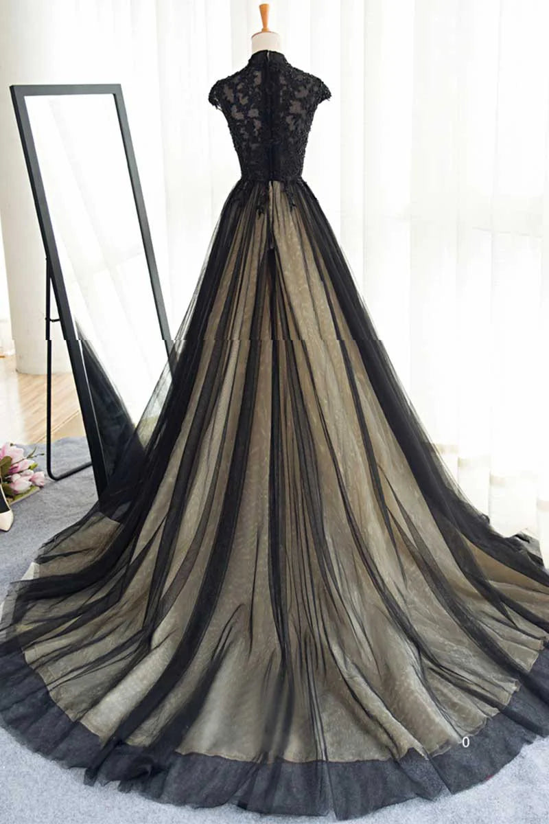 Model posing in a black tulle lace sleeveless A-line evening gown, showing back detail.