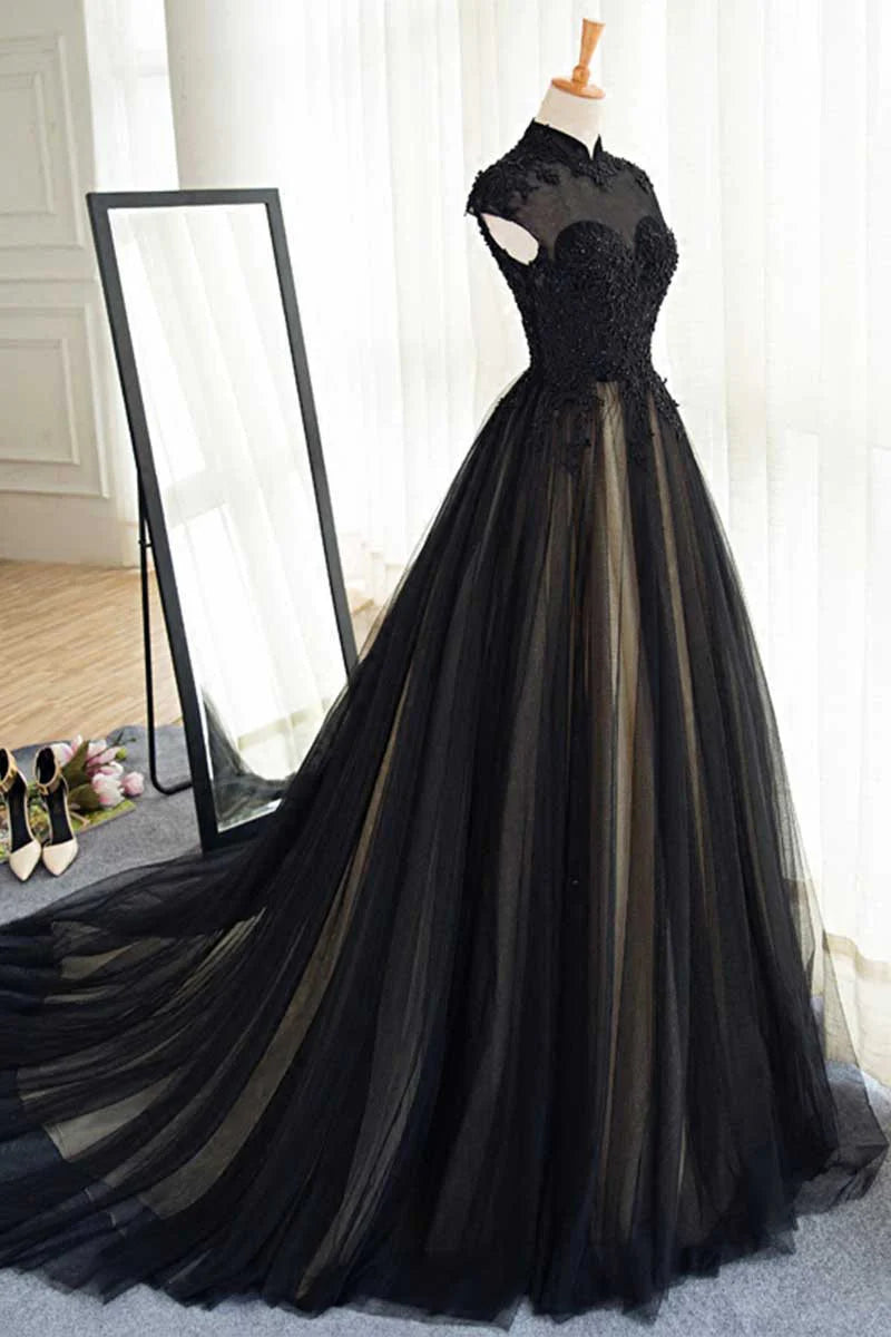 Close-up of the black tulle lace fabric and sleeveless design of the evening dress.