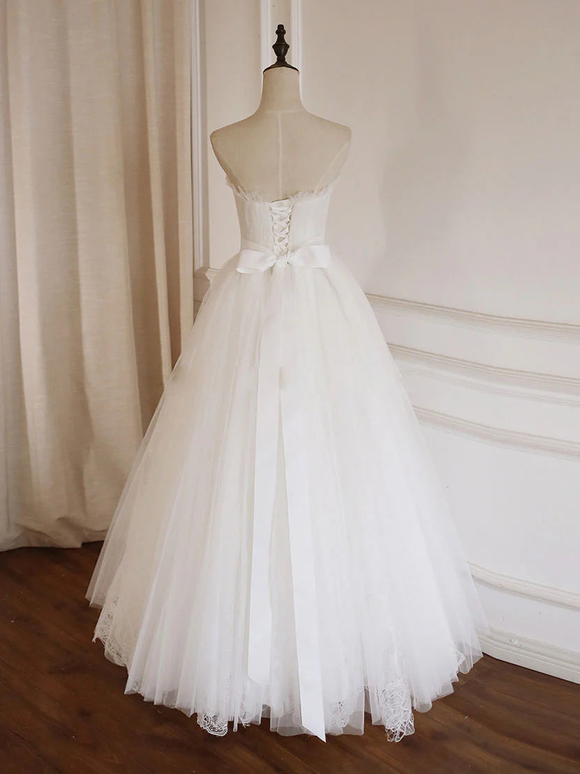 Side view of the white A-line tulle lace long prom dress, showing intricate lace details.