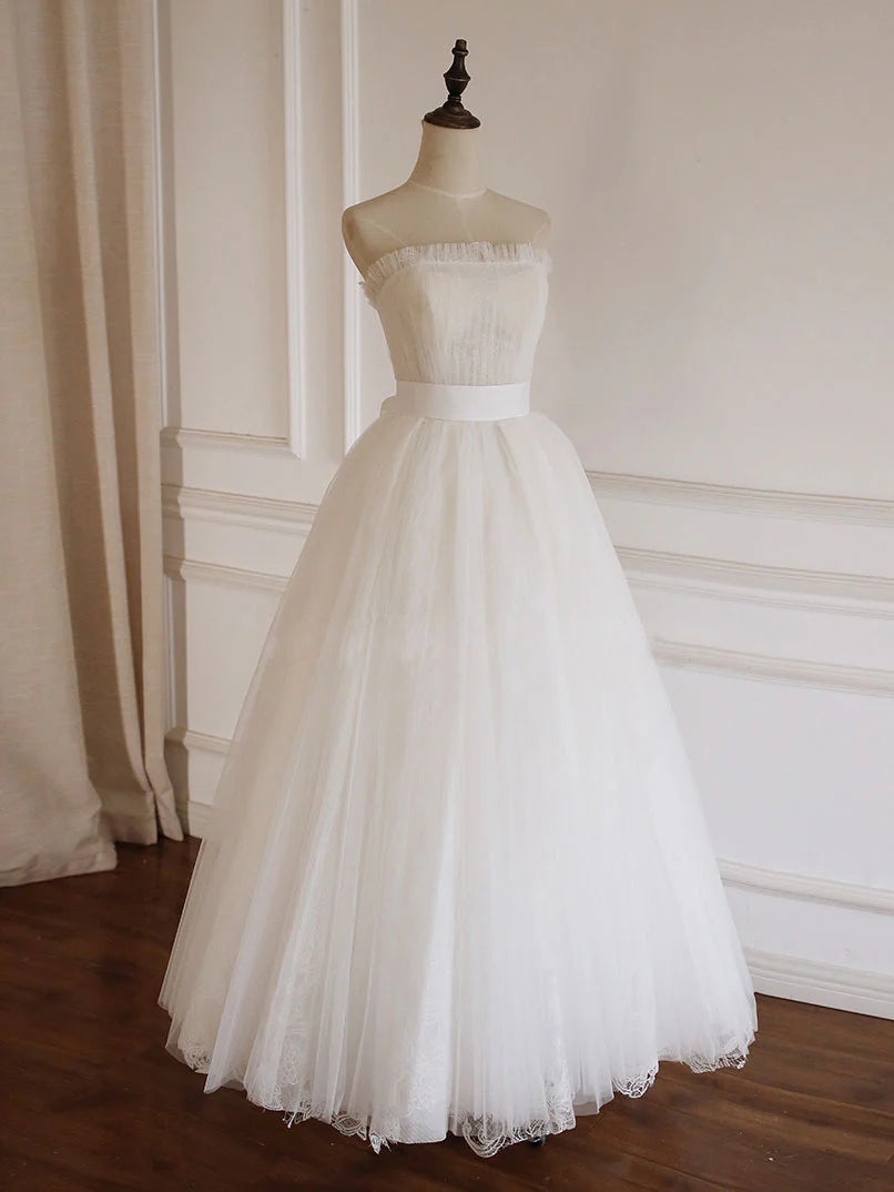 Back view of the white A-line tulle lace long prom dress, highlighting the flowing train.