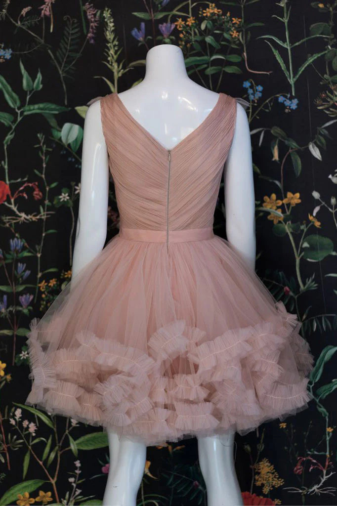 Close-up of the back of the champagne pink short tulle dress with lace-up detail.