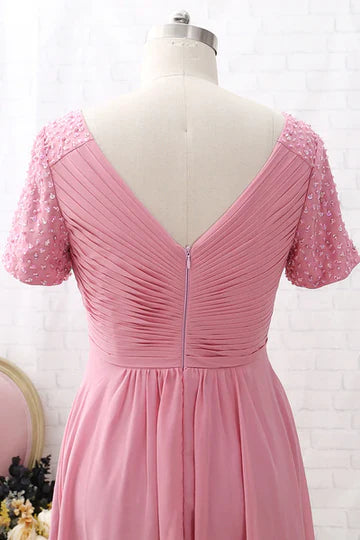 Back view of the pink V-neck chiffon dress, highlighting the elegant drape and sleeve detail.