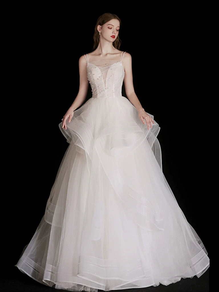 Elegant white tulle long prom dress with a beaded V-neck bodice.