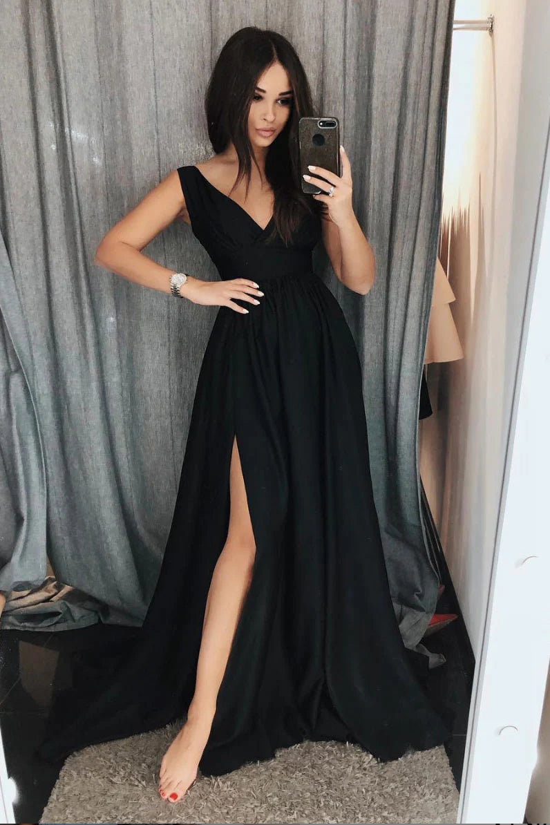 Woman wearing an elegant black V-neck satin long prom dress.