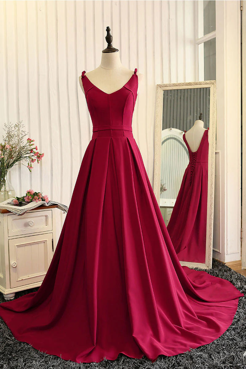 Model wearing a red V-neck satin long prom dress, front view.