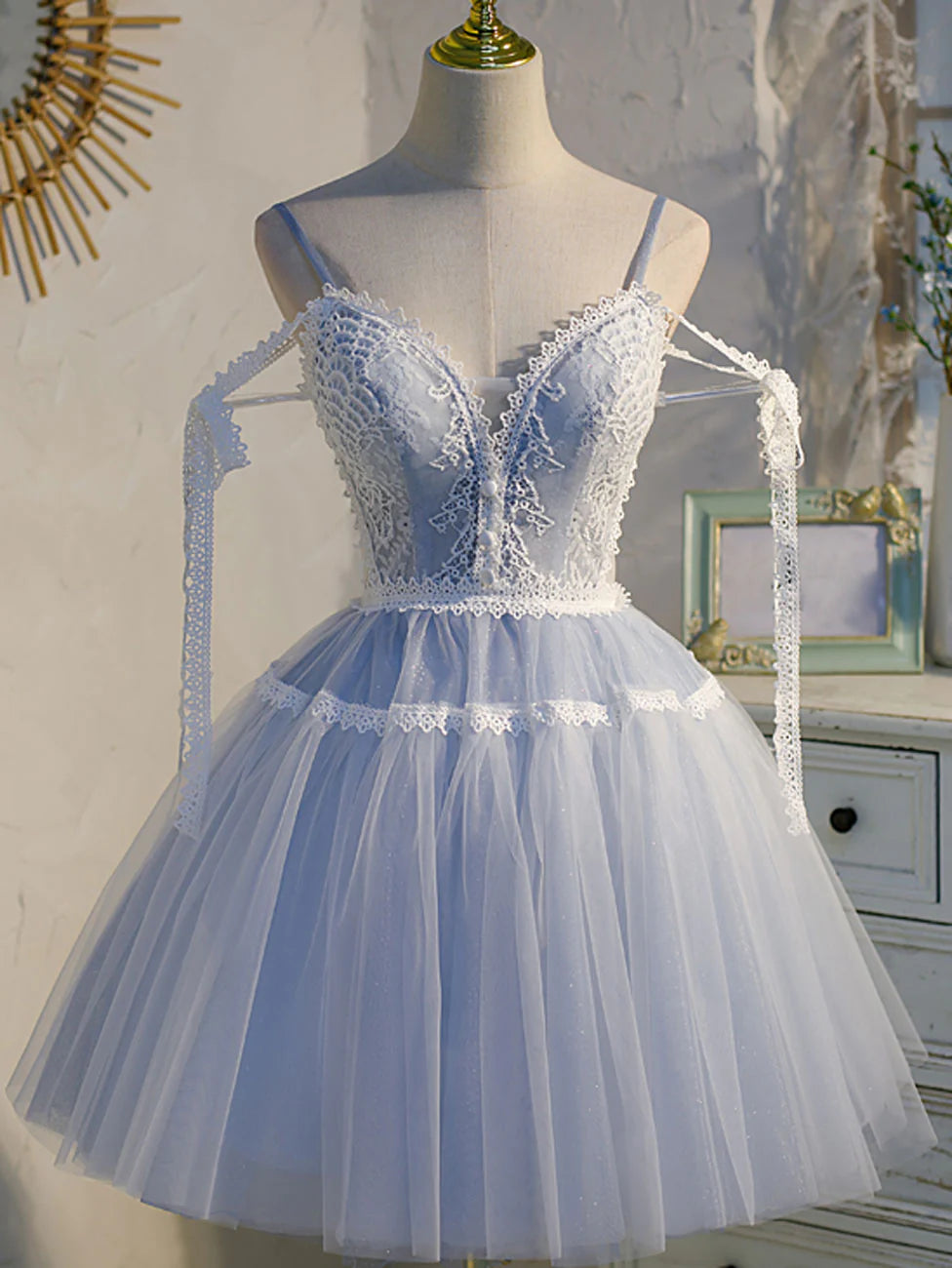 Blue A-line V-neck lace short prom dress on a model.