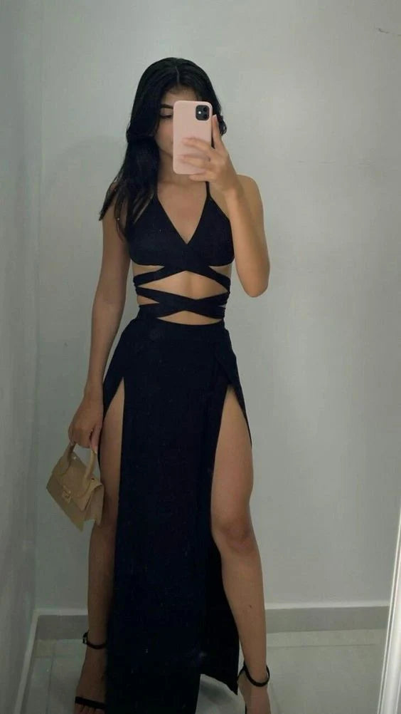 Woman wearing an elegant A-line V-neck long prom dress in a light color.
