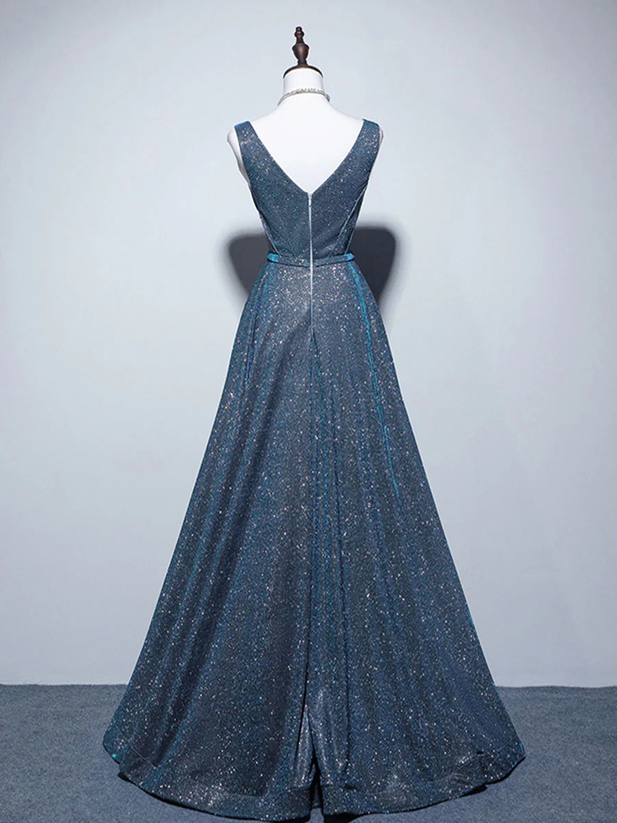 Close-up of the V-neckline and satin fabric of a blue formal gown.