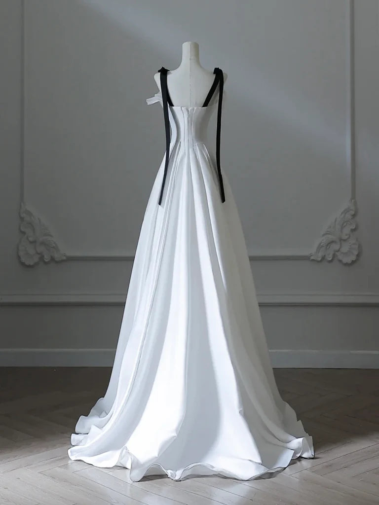 Back view of a model showcasing a white A-line satin long evening dress.
