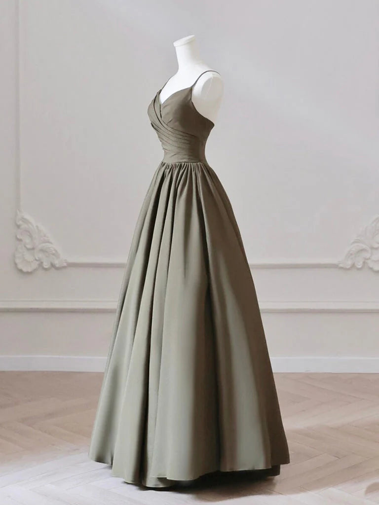 Close-up of the V-neckline and satin fabric of the olive green dress.