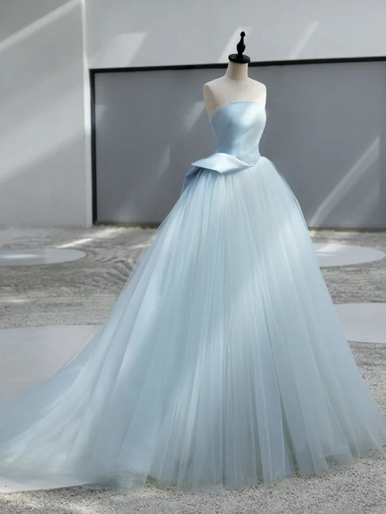 Back view of a model wearing the long blue formal gown.
