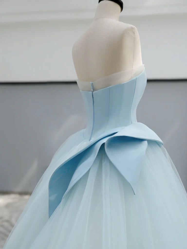 Side profile of a model showcasing the blue A-line evening dress.