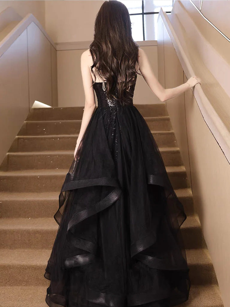 Back view of the black A-line sequin prom gown.