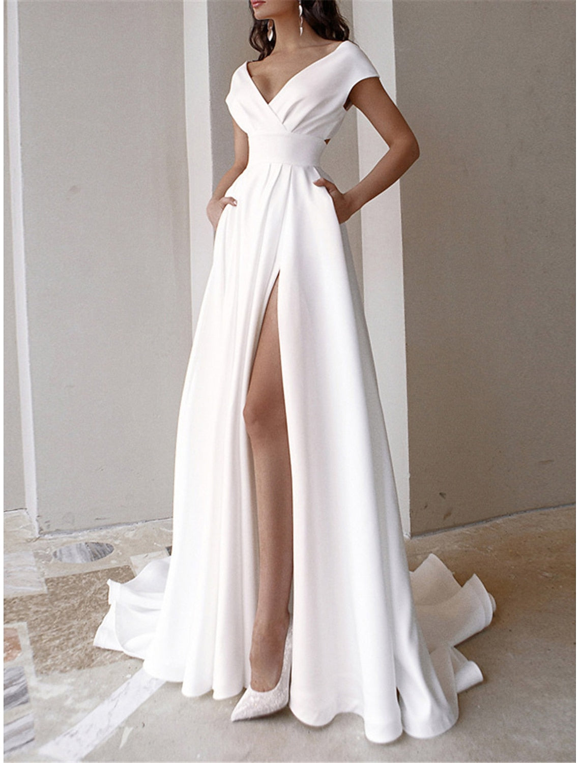 Back view of sophisticated white formal dress for women.