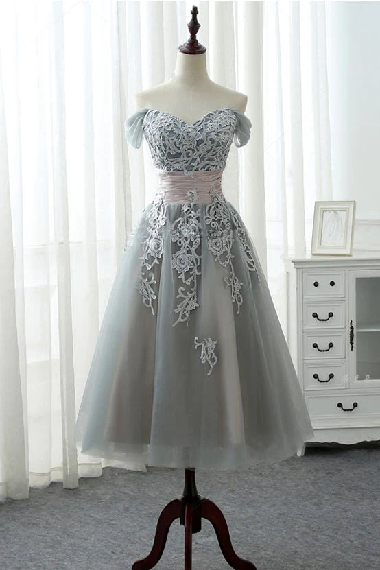 Elegant gray lace tulle prom dress with V-neck and cinched waist.