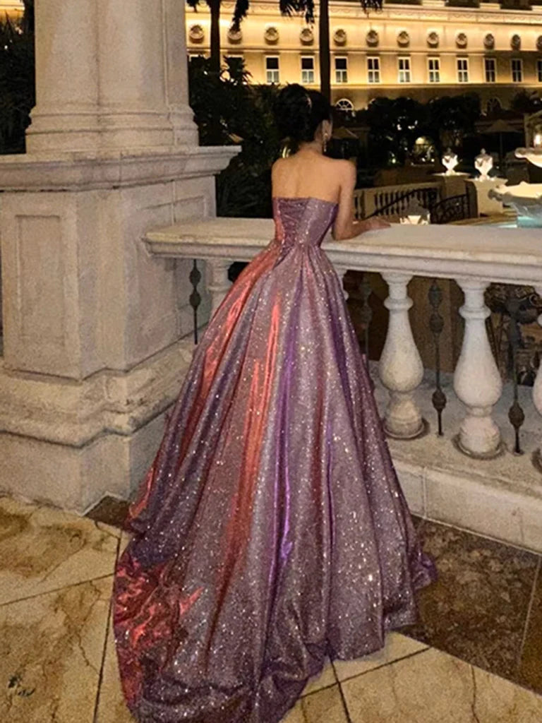 Model showcasing a sophisticated dark red satin formal gown with a V-neck and A-line silhouette.