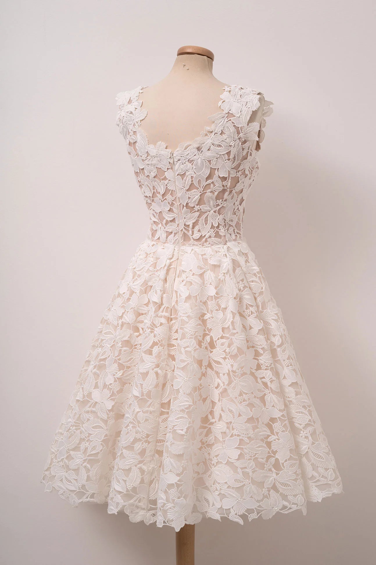 Ivory white lace homecoming dress with delicate details.