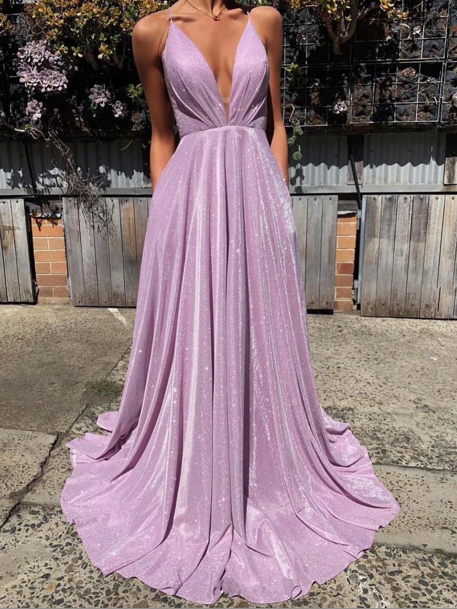 Woman in elegant purple V-neck satin long prom dress, front view.