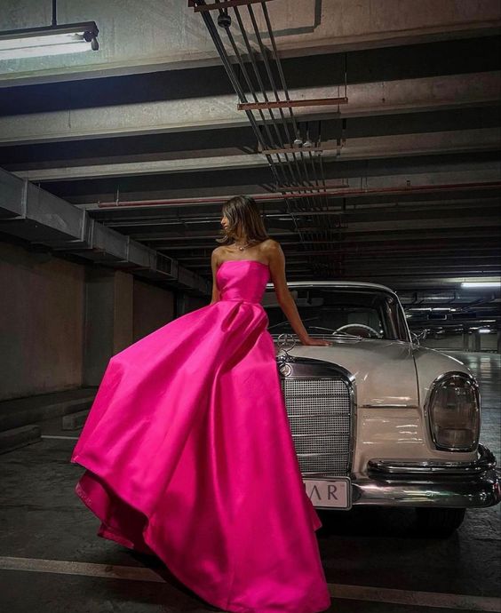 Back view of the pink satin floor-length prom dress.