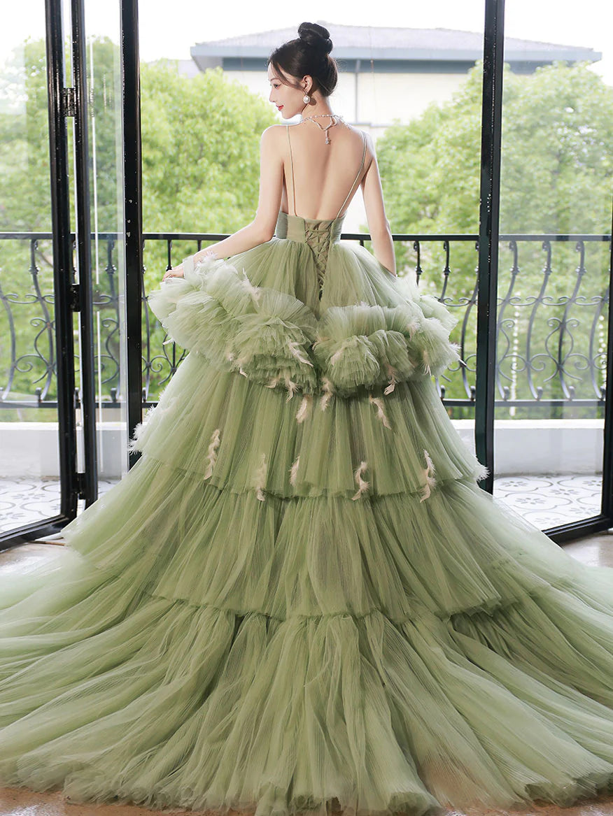 Elegant green V-neck tulle gown for a Sweet 16 celebration.