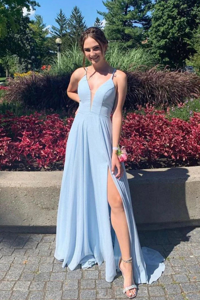 Woman wearing an elegant blue V-neck tulle long prom dress, front view.